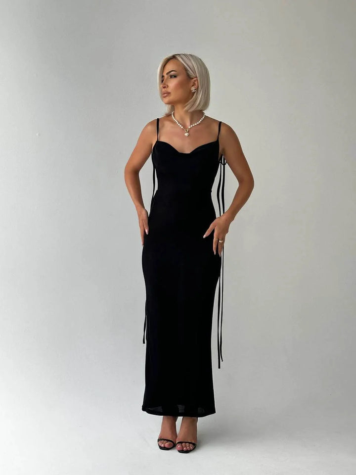Backless top in black made from soft cotton blend with adjustable ties for a stylish look.