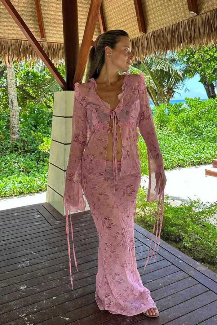 Pink ruffled blouse and flowing maxi skirt set in soft chiffon fabric, perfect for a feminine and elegant look.