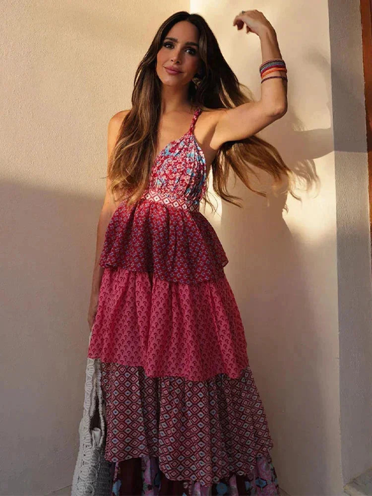 "Sleeveless red and pink dress with multiple tiers in soft and flowing fabric, perfect for a chic and comfortable look."