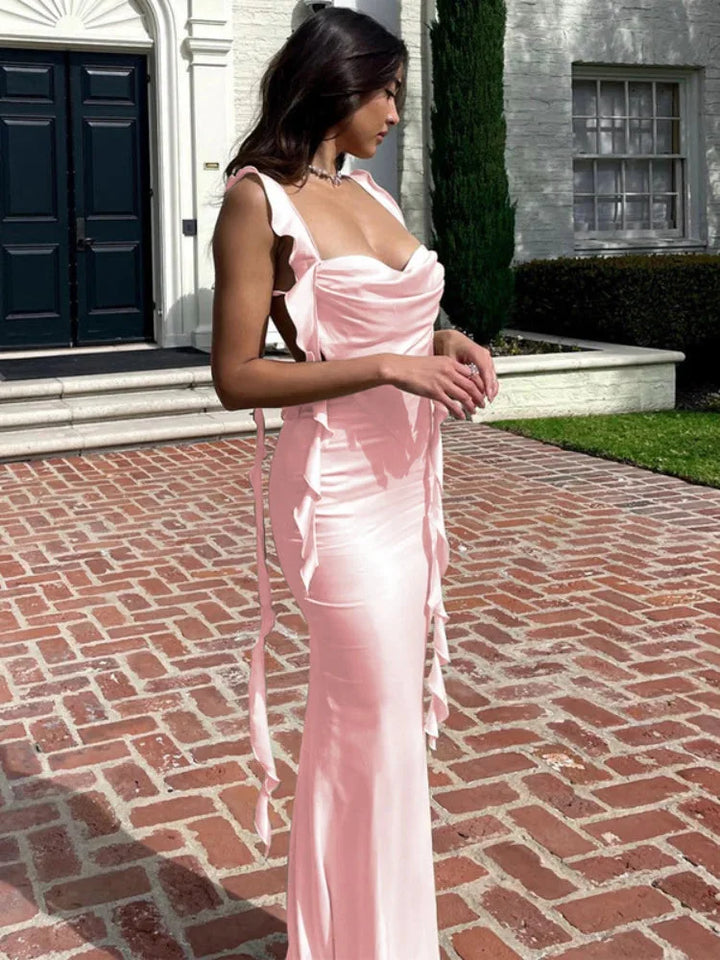 Pink satin midi dress with adjustable straps. Elegant design perfect for special occasions or a night out.