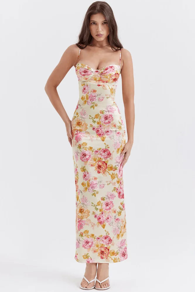 Yellow floral maxi dress with charming sparkles on a pink background. Features a flattering design perfect for a special…