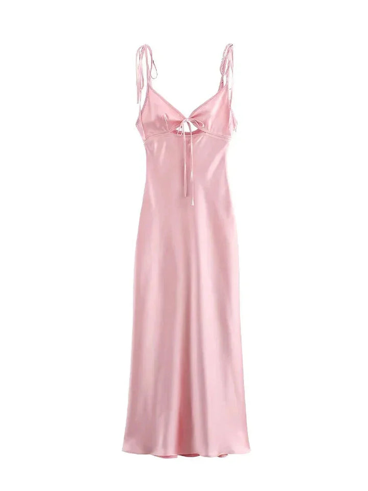 Soft pink satin maxi dress with adjustable straps, elegant and comfortable design, perfect for any occasion.