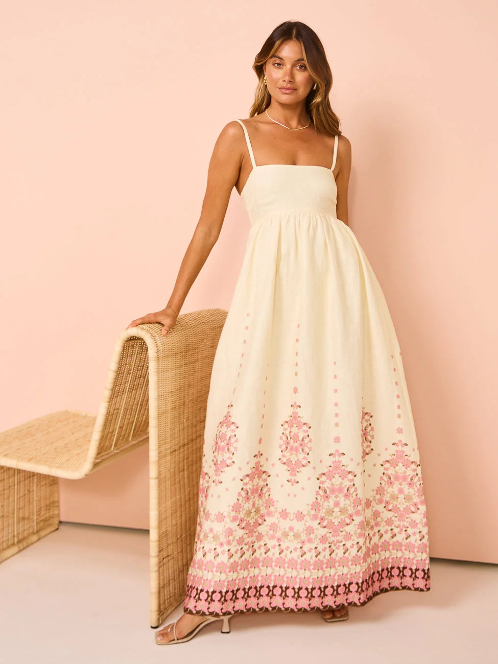 "White summer dress with floral print and detailed hem, perfect for warm weather days. Made from lightweight and breathable…