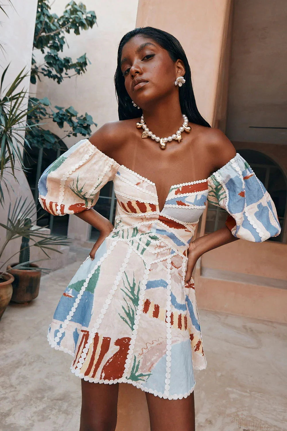 "White off-shoulder dress with elegant pattern, perfect for summer. Made of lightweight, breathable fabric for a comfortable…