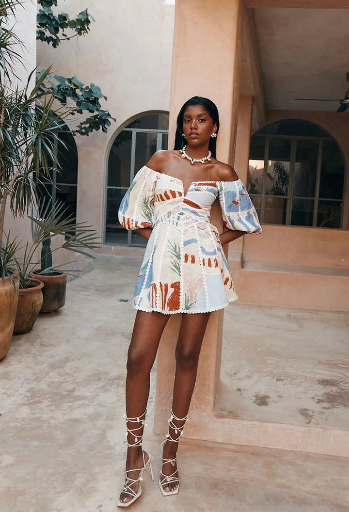 White patterned off-shoulder dress for women by Adaya showcasing a stylish design with a summer-ready silhouette and soft…