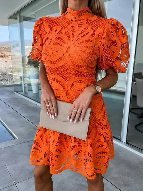 "Orange mini lace dress with puff sleeves, intricate lace detailing, perfect for a stylish and trendy look."