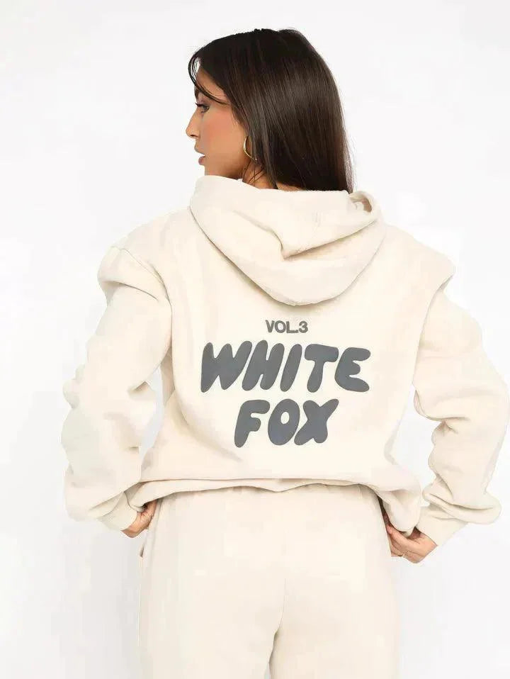 "Beige two-piece set featuring cozy hoodie and pants. Soft fabric with relaxed fit for casual comfort."