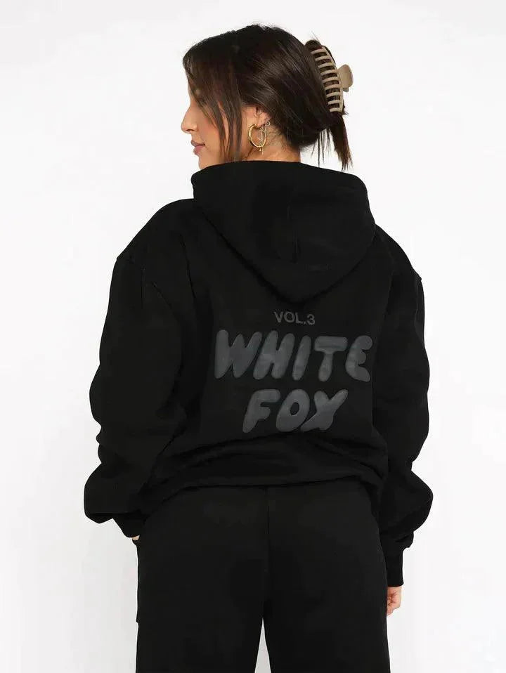 "Black two-piece hoodie and pants set with soft, cozy fabric perfect for casual wear or lounging at home."