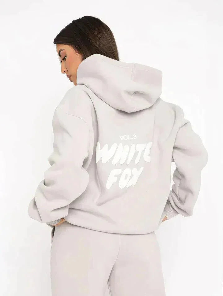 Light Grey two-piece hoodie and pants set in soft fabric perfect for lounging. Effortlessly chic design for your casual…