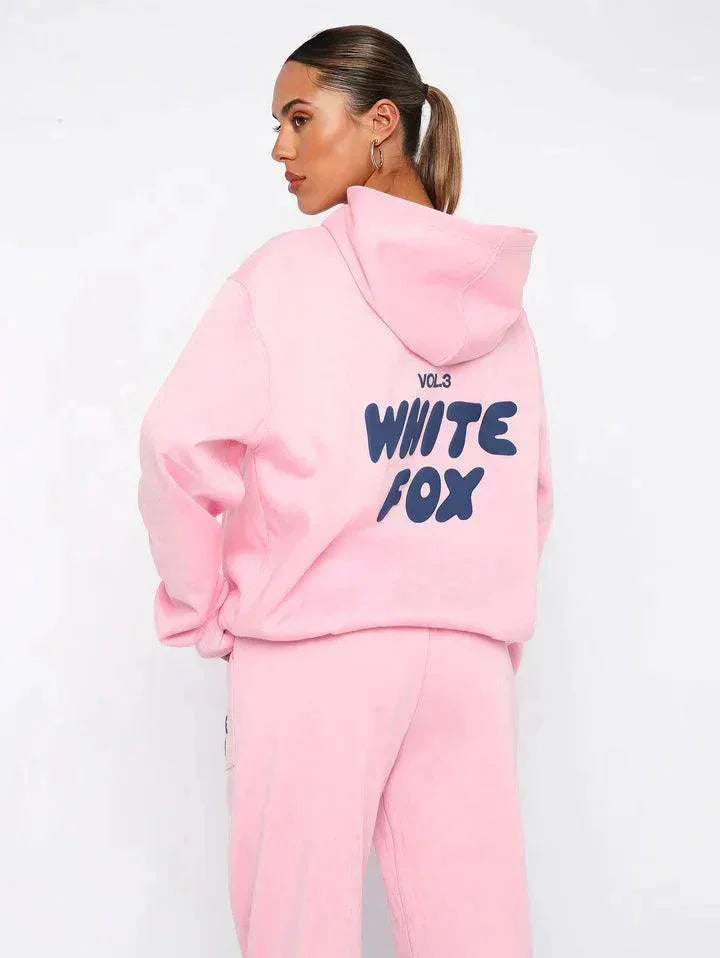 Pink two-piece hoodie and pants set in a soft, cozy fabric. Designed for comfort and style with a relaxed fit, perfect for…