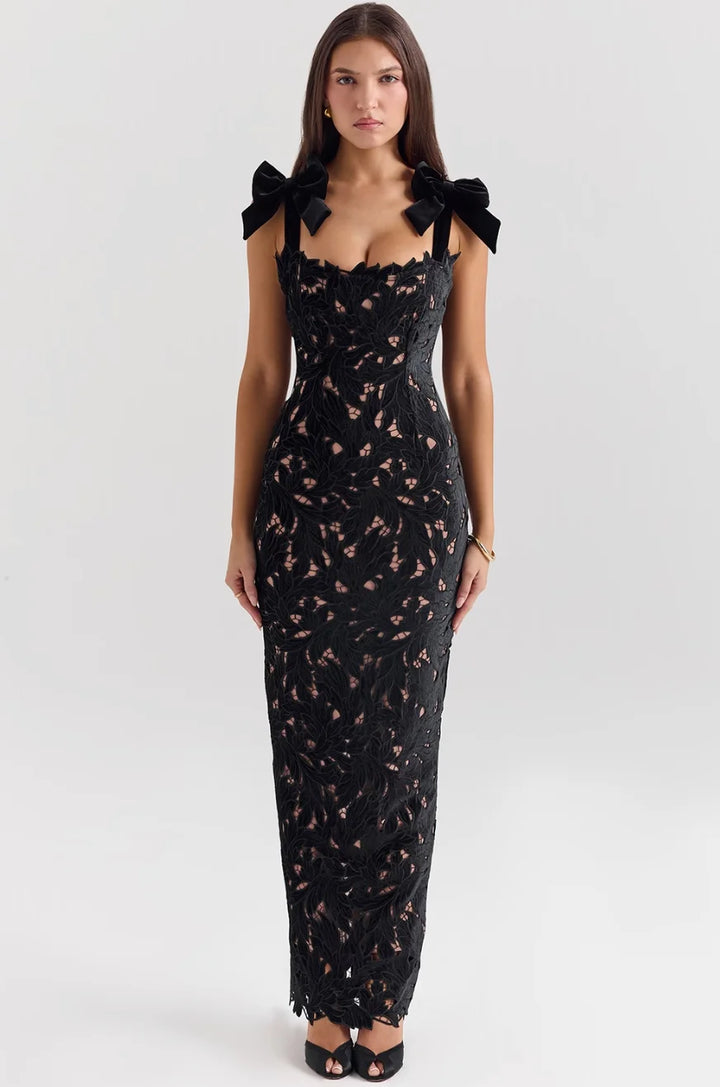 "Sleeveless lace maxi dress featuring delicate bows, perfect for special occasions"