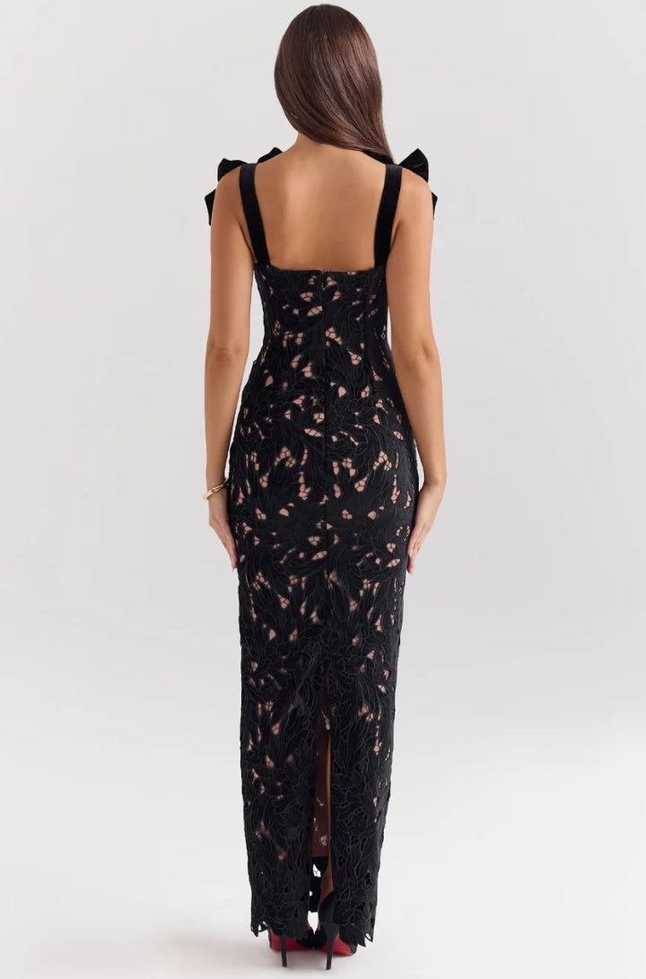 "Sleeveless lace maxi dress in ivory with bow detailing, a perfect blend of elegance and charm."