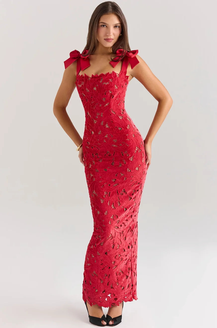"Sleeveless red lace maxi dress with decorative bows, perfect for elegant occasions."