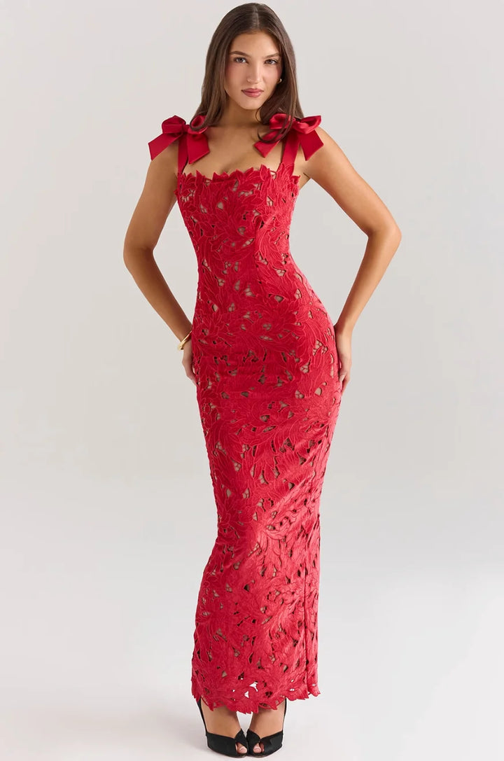 "Sleeveless red lace maxi dress with decorative bows, perfect for elegant occasions."