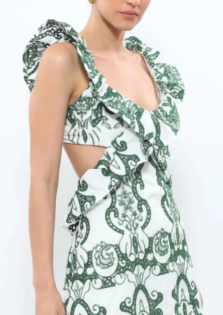 White and green ruffled maxi dress made of lightweight cotton with a flowy design, perfect for summertime events or casual…