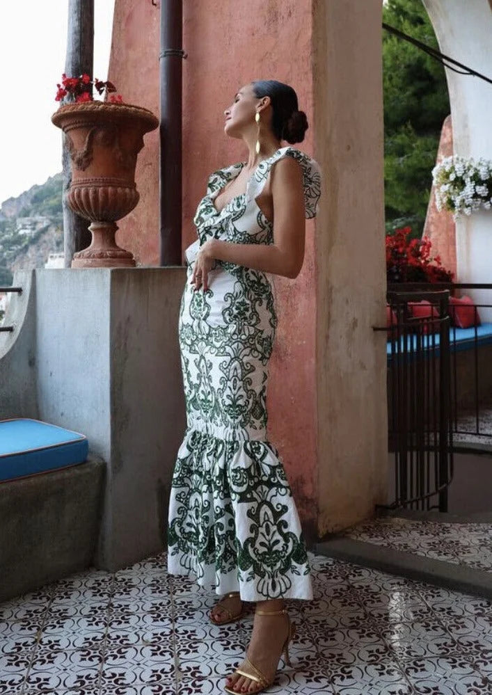 White and green ruffled maxi dress made of breathable cotton blend, perfect for summer outings or casual gatherings.