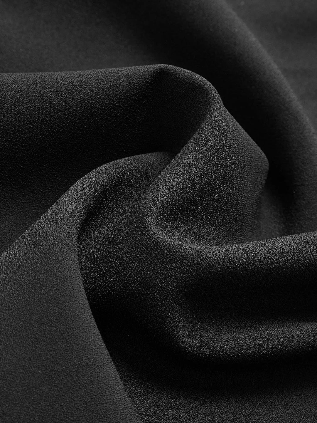 Sleeveless blouse with an asymmetric neck design in a soft and flowing fabric, perfect for adding a unique touch to your…