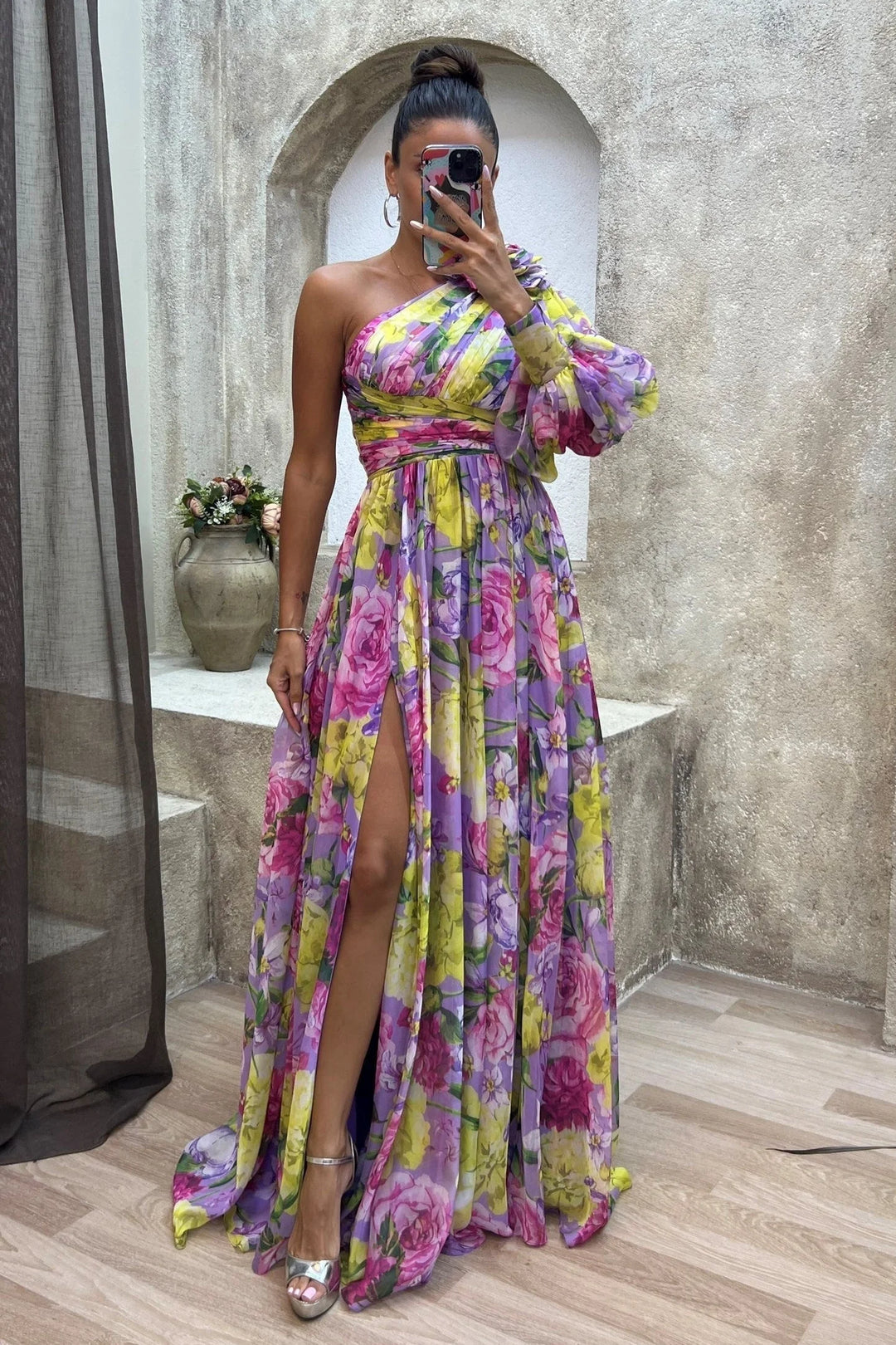 One-shoulder floral dress in flowy fabric with asymmetrical design, perfect for a summer day out.