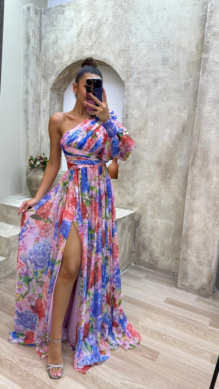 One-shoulder floral dress by Afnan featuring a flowy design with intricate floral patterns on soft, lightweight fabric.