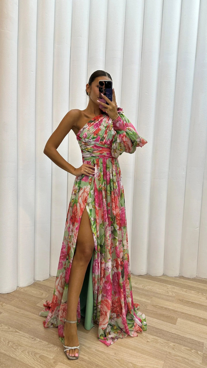 Pink one-shoulder floral dress with a flowy design. Made of soft fabric with intricate floral pattern, perfect for a stylish…