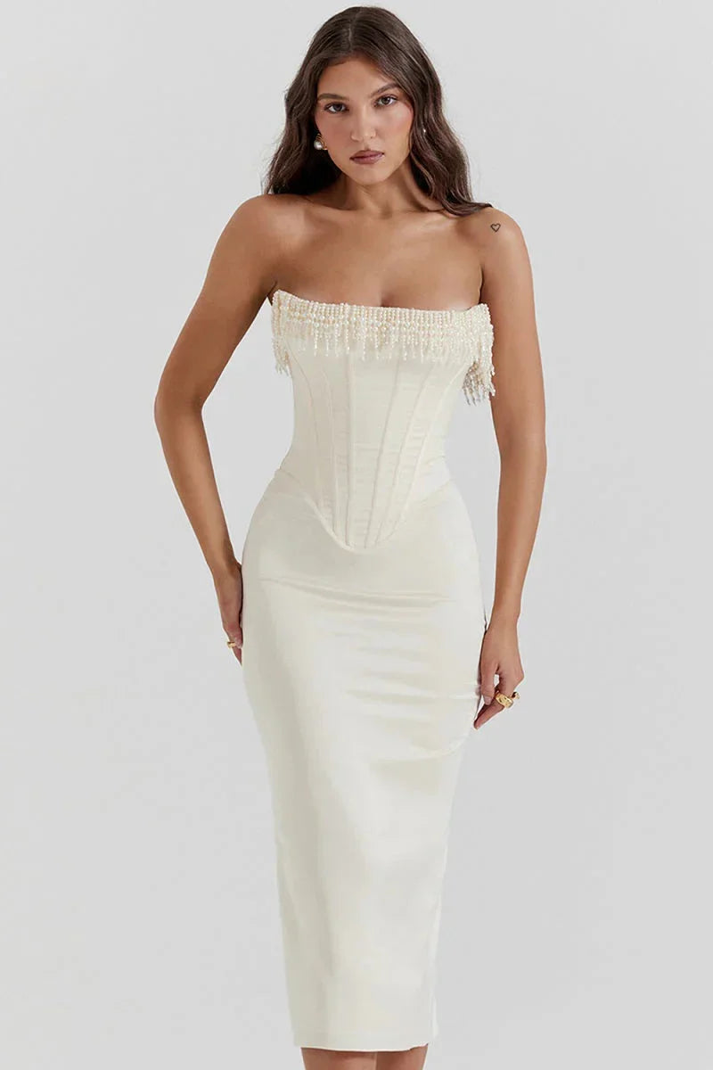 Ivory strapless midi dress adorned with intricate bead detailing, perfect for a special occasion or event.