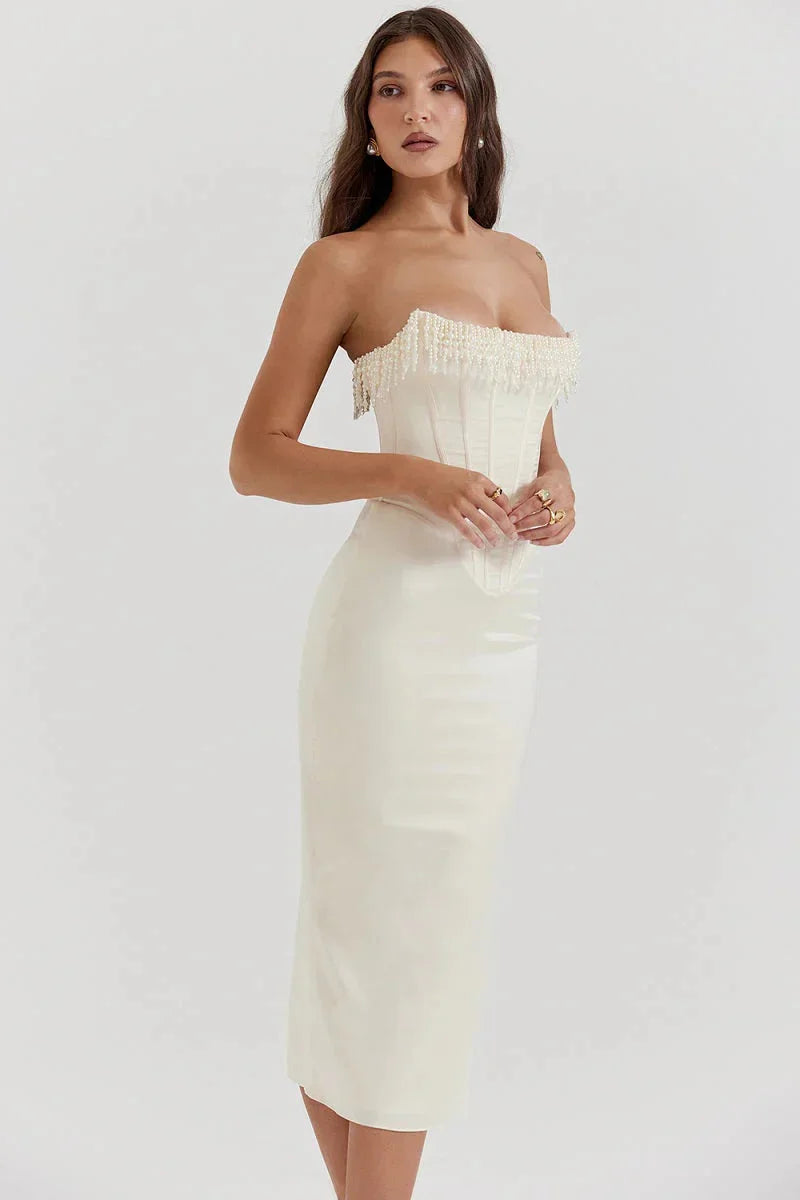 "Ivory strapless midi dress featuring intricate bead embellishments for a sophisticated look."