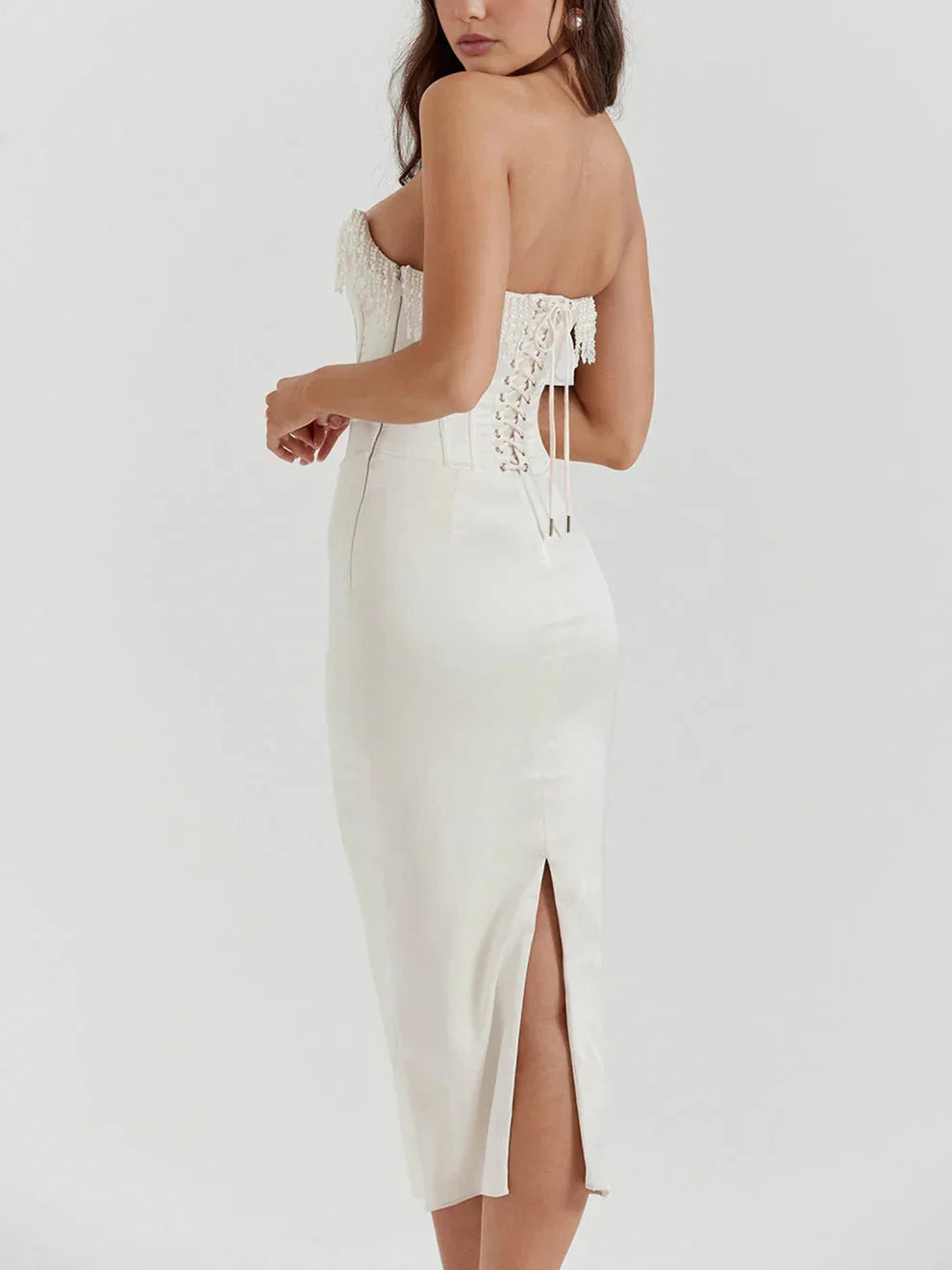 "Ivory strapless midi dress featuring delicate bead embellishments, perfect for a special occasion."