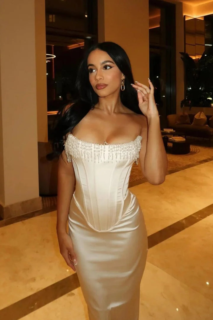 "Aithana ivory strapless midi dress featuring intricate bead detailing, perfect for a special occasion outfit."