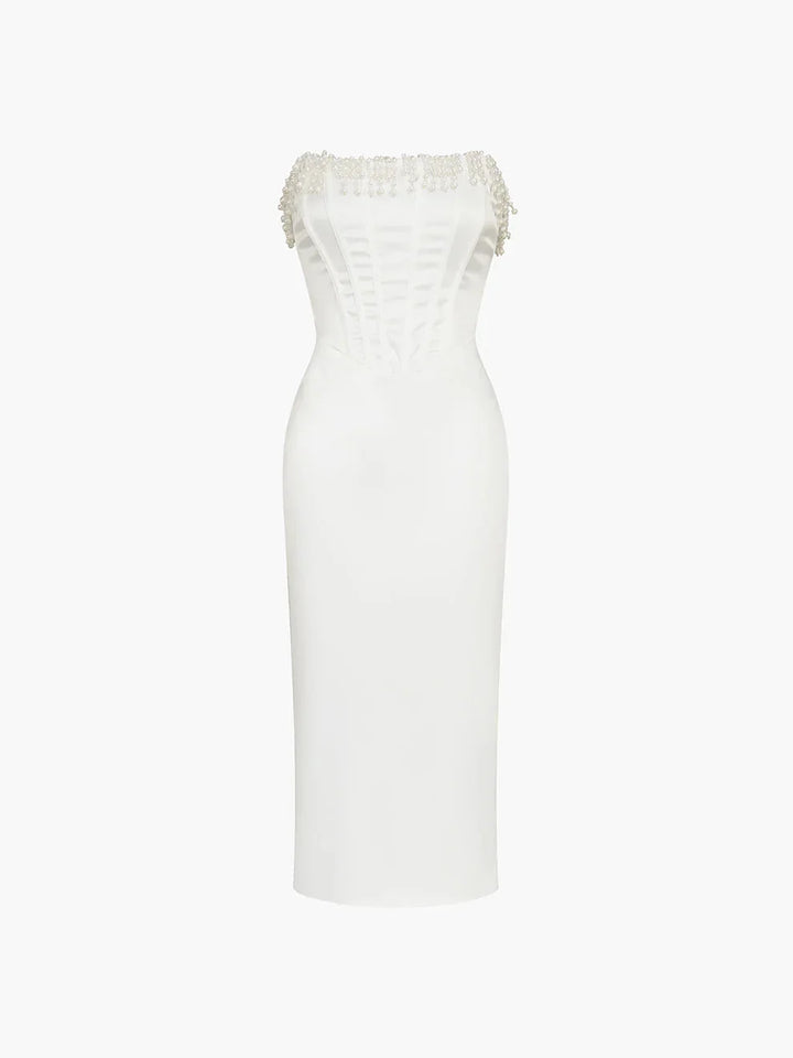 "Ivory strapless midi dress adorned with intricate beadwork, perfect for a formal occasion or special event."