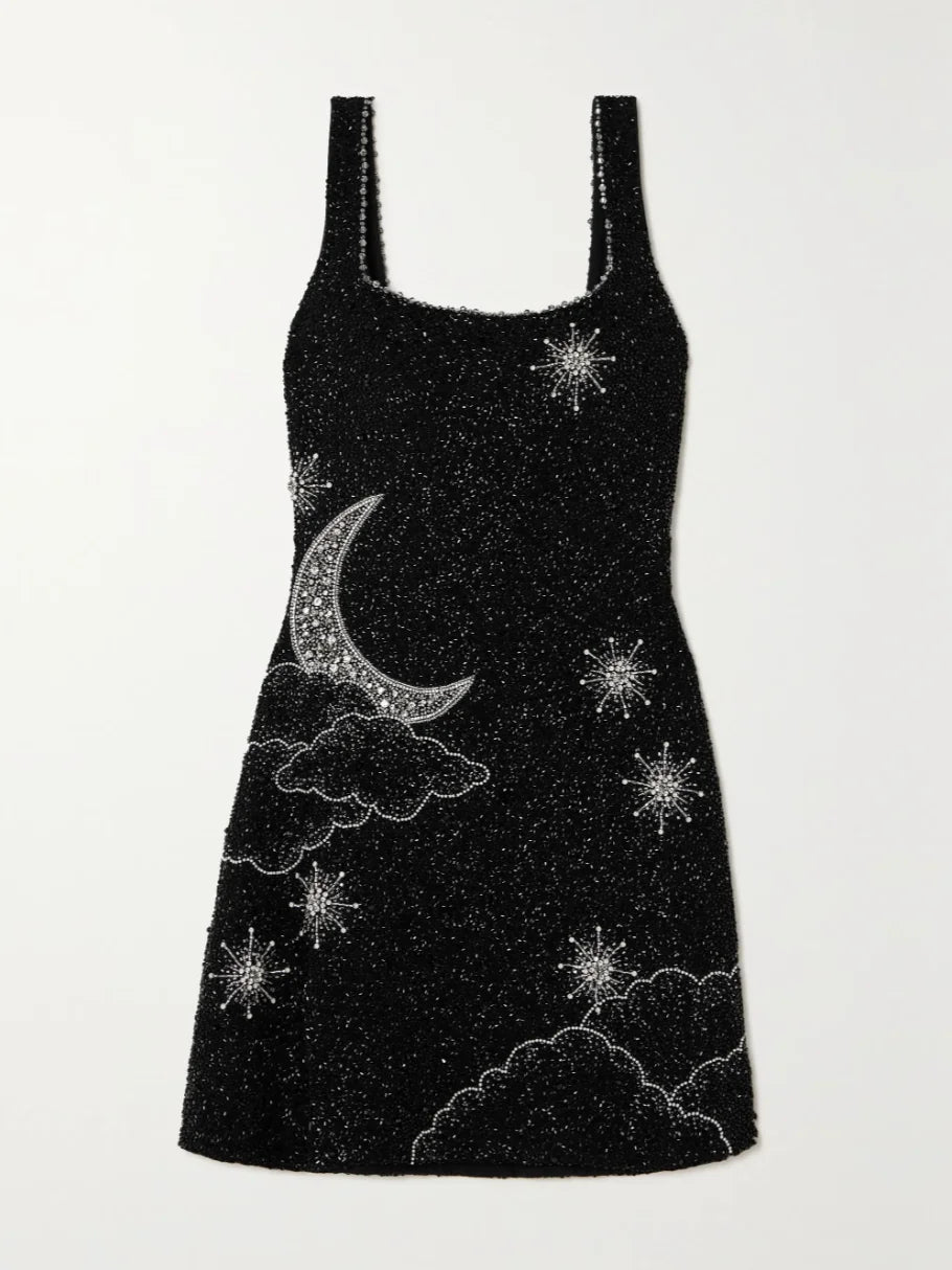 "Black sequin mini dress with side split featuring a glittering design perfect for a glamorous evening out."