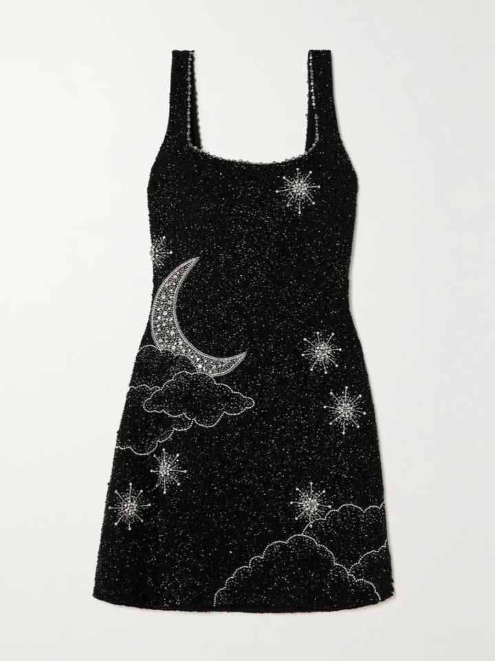 "Black sequin mini dress with side split featuring a glittering design perfect for a glamorous evening out."