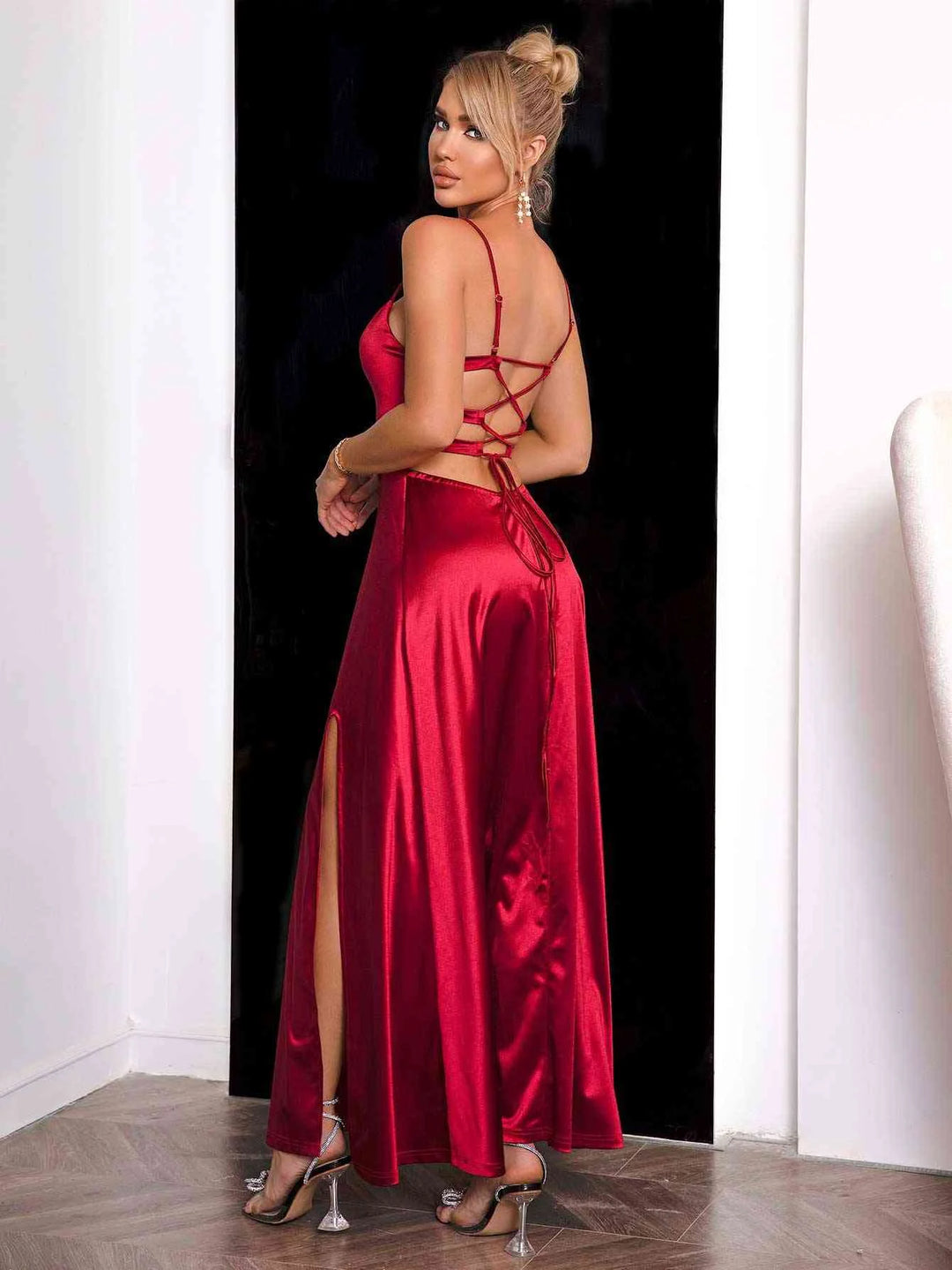 Red satin maxi dress with spaghetti straps, perfect for a special occasion.