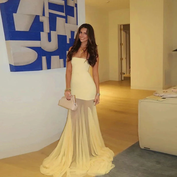 Strapless yellow-to-beige ombre maxi dress, showcasing a gradient color, perfect for summer days.