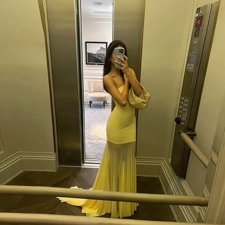 Strapless ombre maxi dress in yellow-to-beige hues, perfect for a summery vibe.
