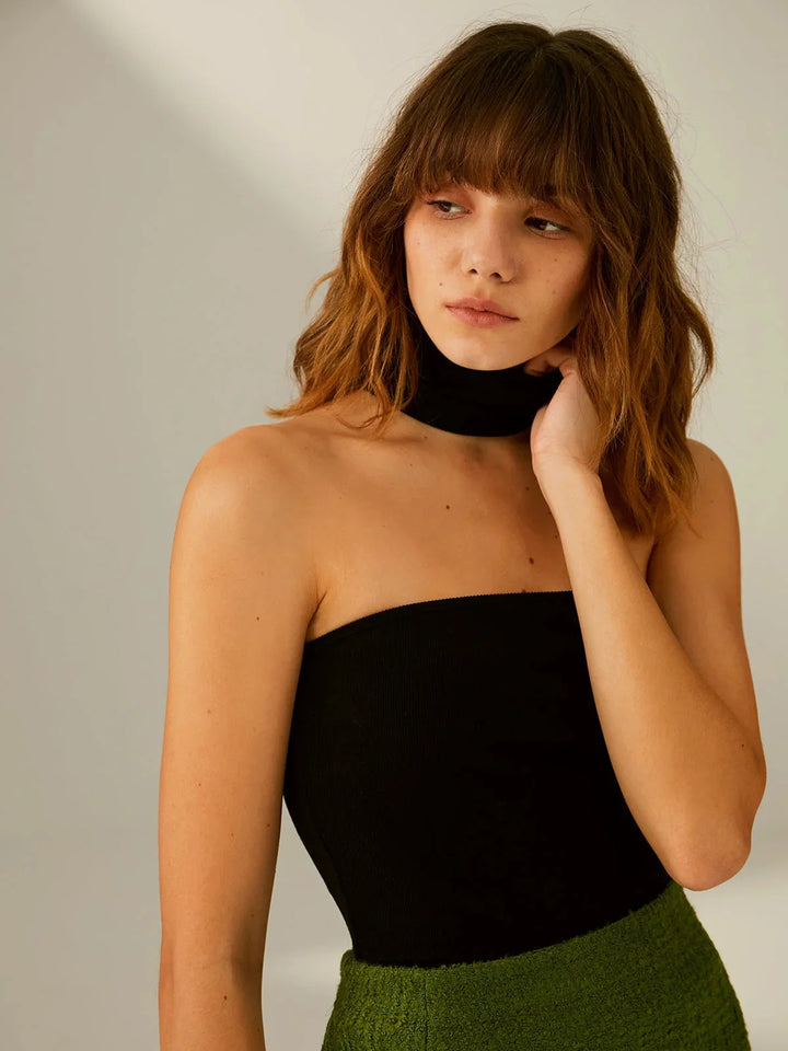 Black top with integrated choker design in soft stretch fabric, perfect for adding a touch of edgy flair to any outfit.