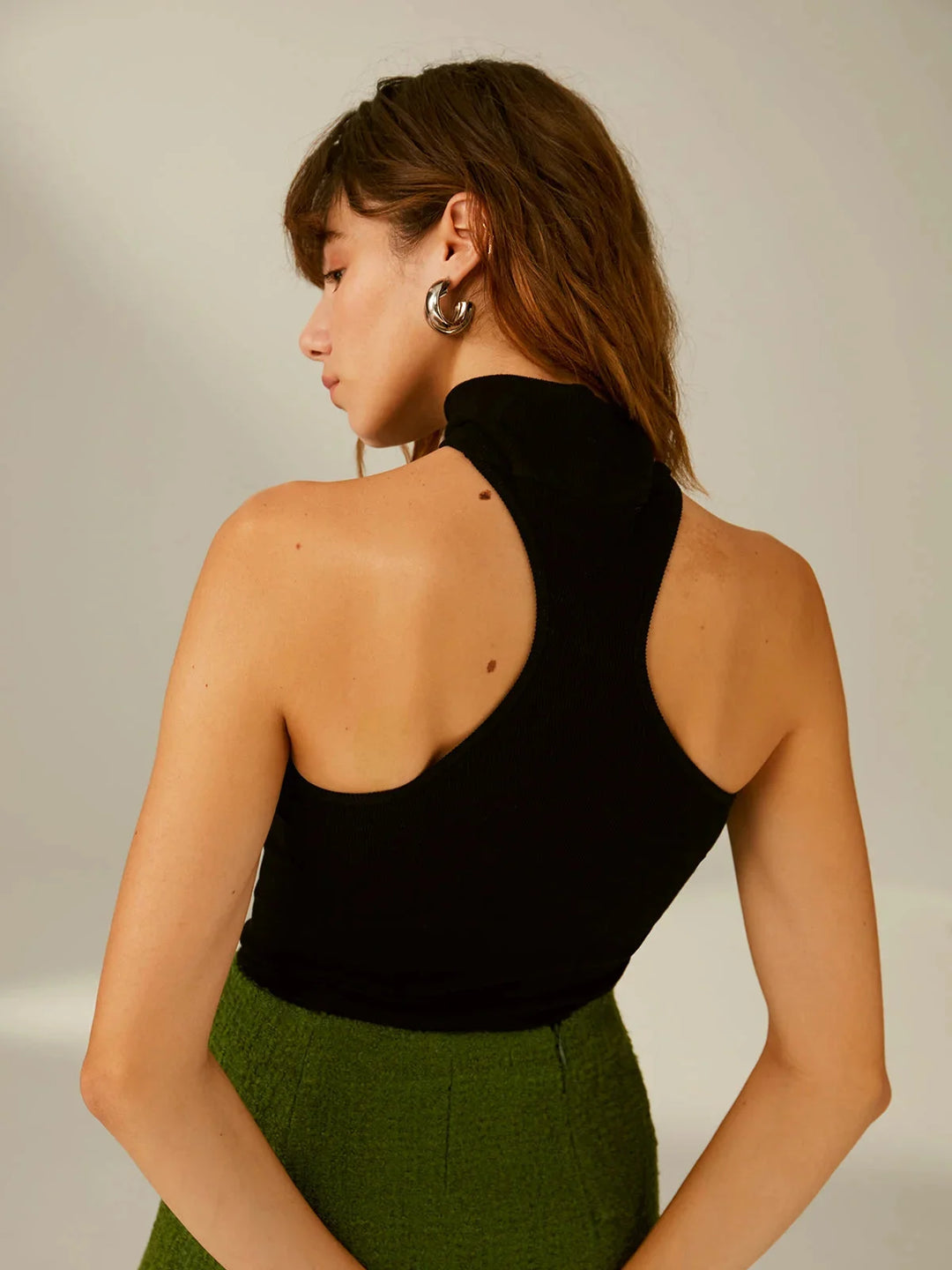 "Black top with choker design, made of soft fabric, trendy and chic style for a modern look."