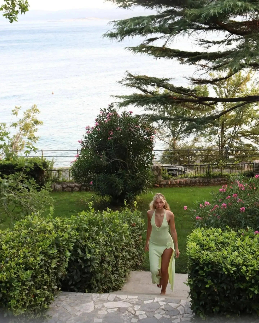 "Alena halter neck maxi dress in navy with floral appliqué, perfect for summer outings and special occasions."