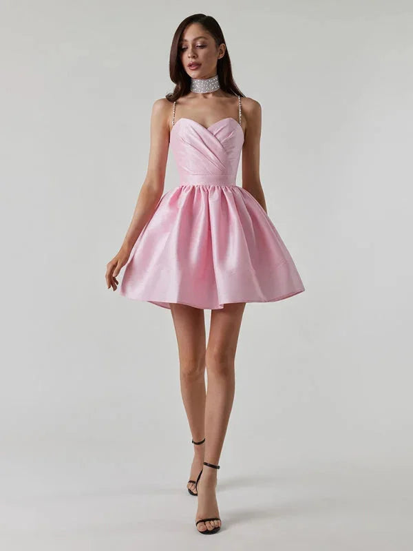 Satin mini dress with rhinestone straps, perfect for a glamorous night out.