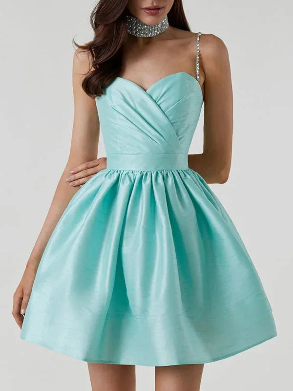 Blue satin mini dress with rhinestone straps by Alethea, a dazzling choice for your next event.