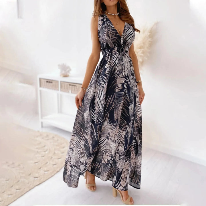 "Navy sleeveless maxi dress with floral pattern, perfect for summer days. Made from soft and breathable fabric."