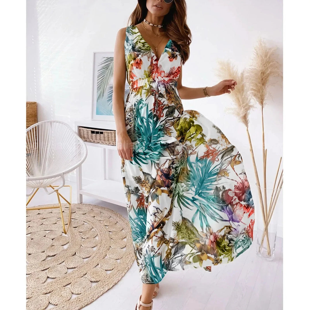 "White sleeveless floral maxi dress with a flowing design perfect for summertime, made from lightweight breathable fabric."