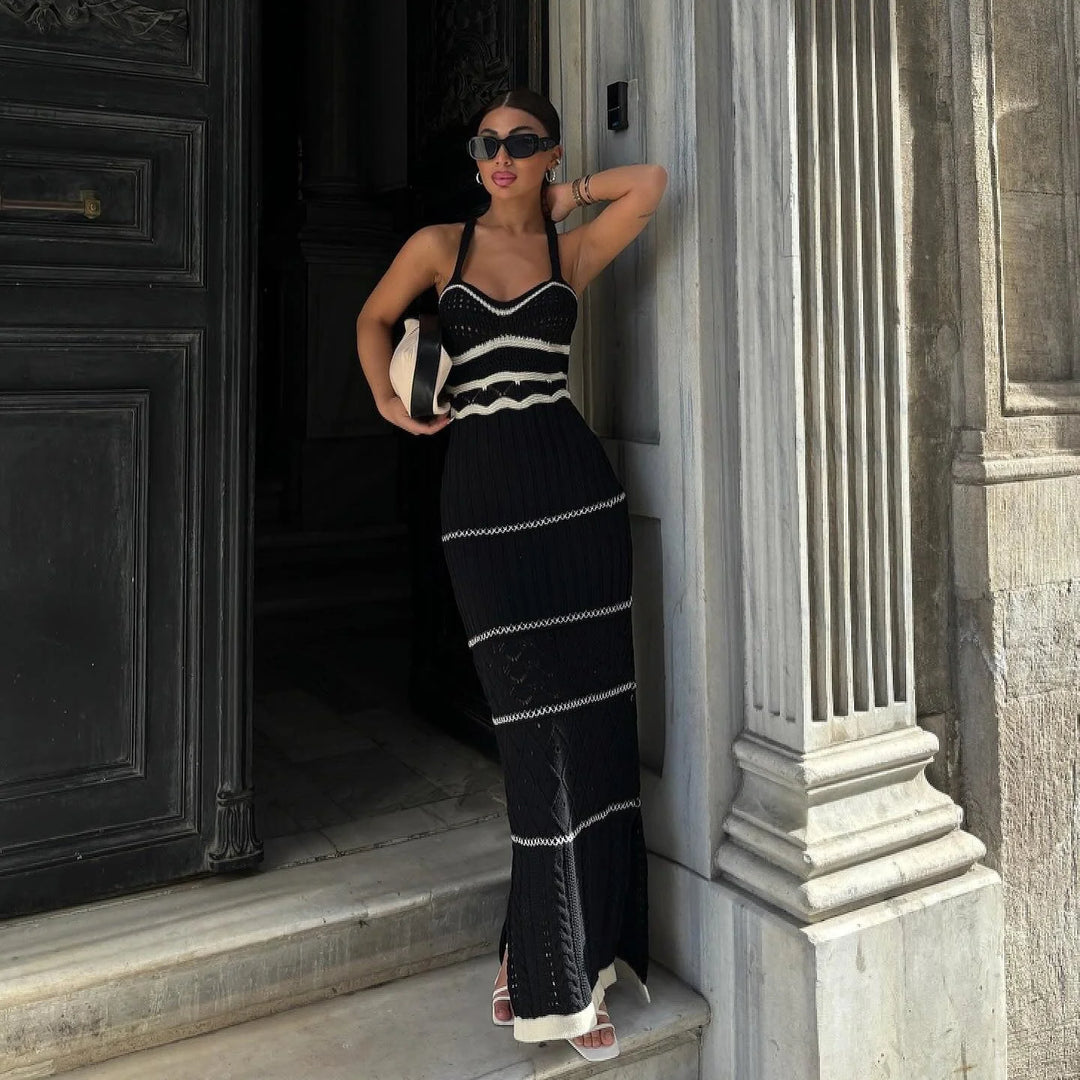 "Black fitted knit maxi dress crafted from soft, stretchy fabric for a flattering silhouette. Featuring a scoop neckline and…