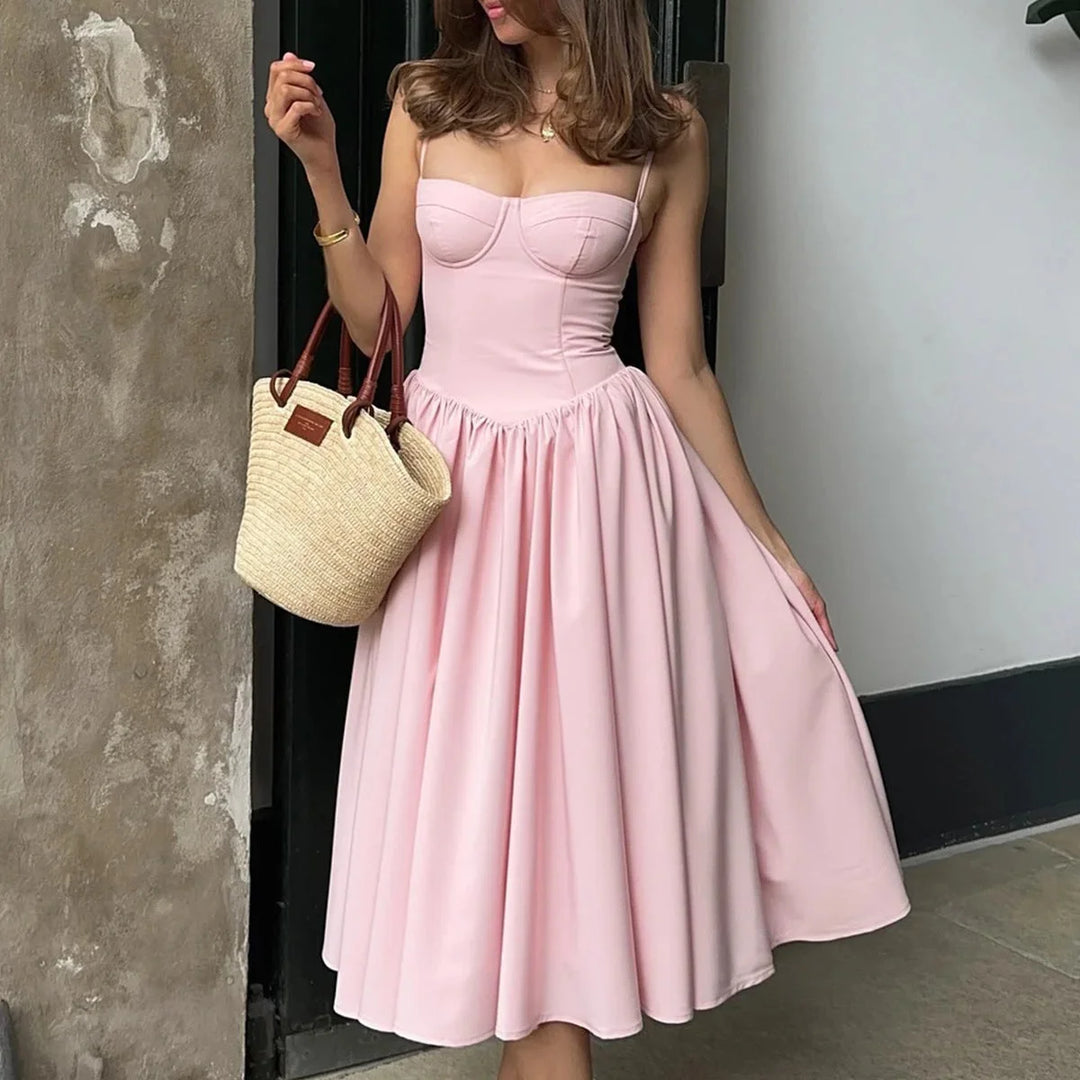 Women’s pink bustier midi dress with flared skirt in Colour, features structured bodice and airy skirt in soft, flowing…