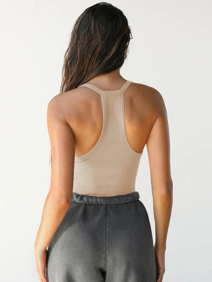 Black seamless athletic tank with racerback design and moisture-wicking fabric for comfortable and unrestricted movement…