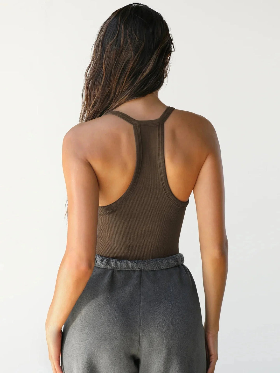 "Black seamless athletic tank top with ribbed texture for active wear"