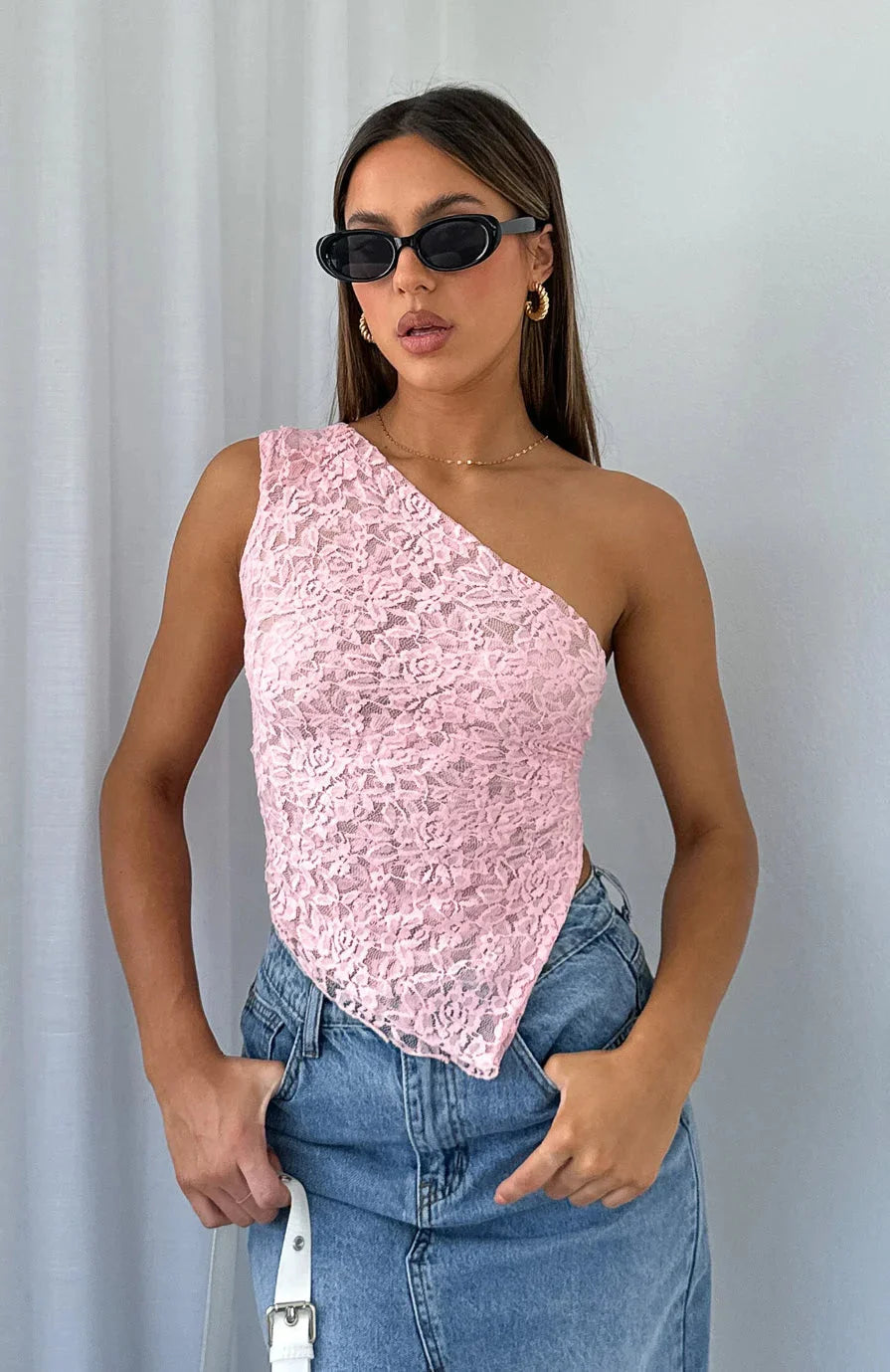 Pink halter top with lace texture for women by Amada. Feminine and elegant design perfect for casual outings or special…