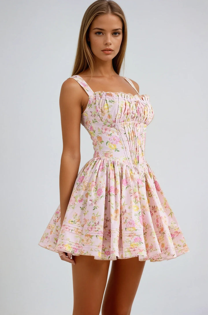 Pink floral mini dress with corset top featuring a charming floral print and structured bodice, perfect for a chic and…