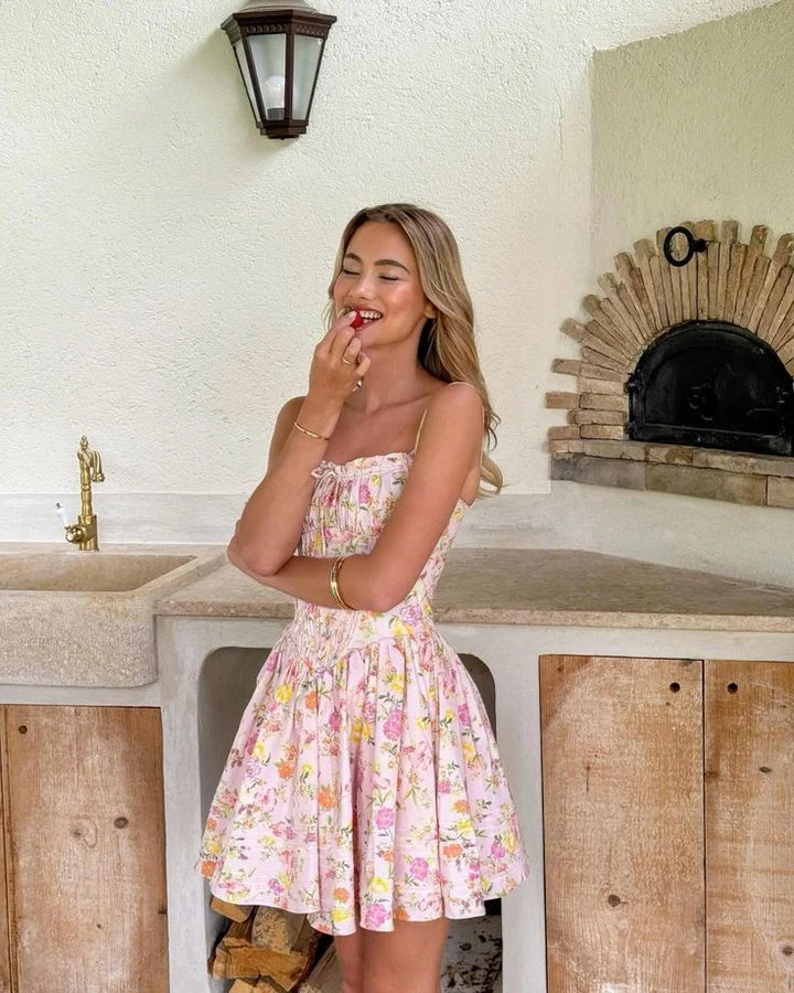 Pink floral dress with corset top, perfect for a chic look. Features a stunning floral pattern and a flattering corset…