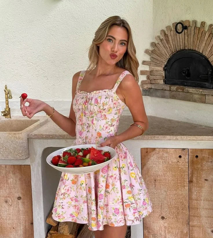 Pink floral mini dress with corset top in soft fabric. Delicate flower print with flattering silhouette for a stylish and…