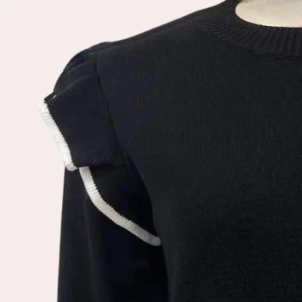 "Black crewneck sweater with ruffle trim detail, perfect for adding a playful touch to your outfits."